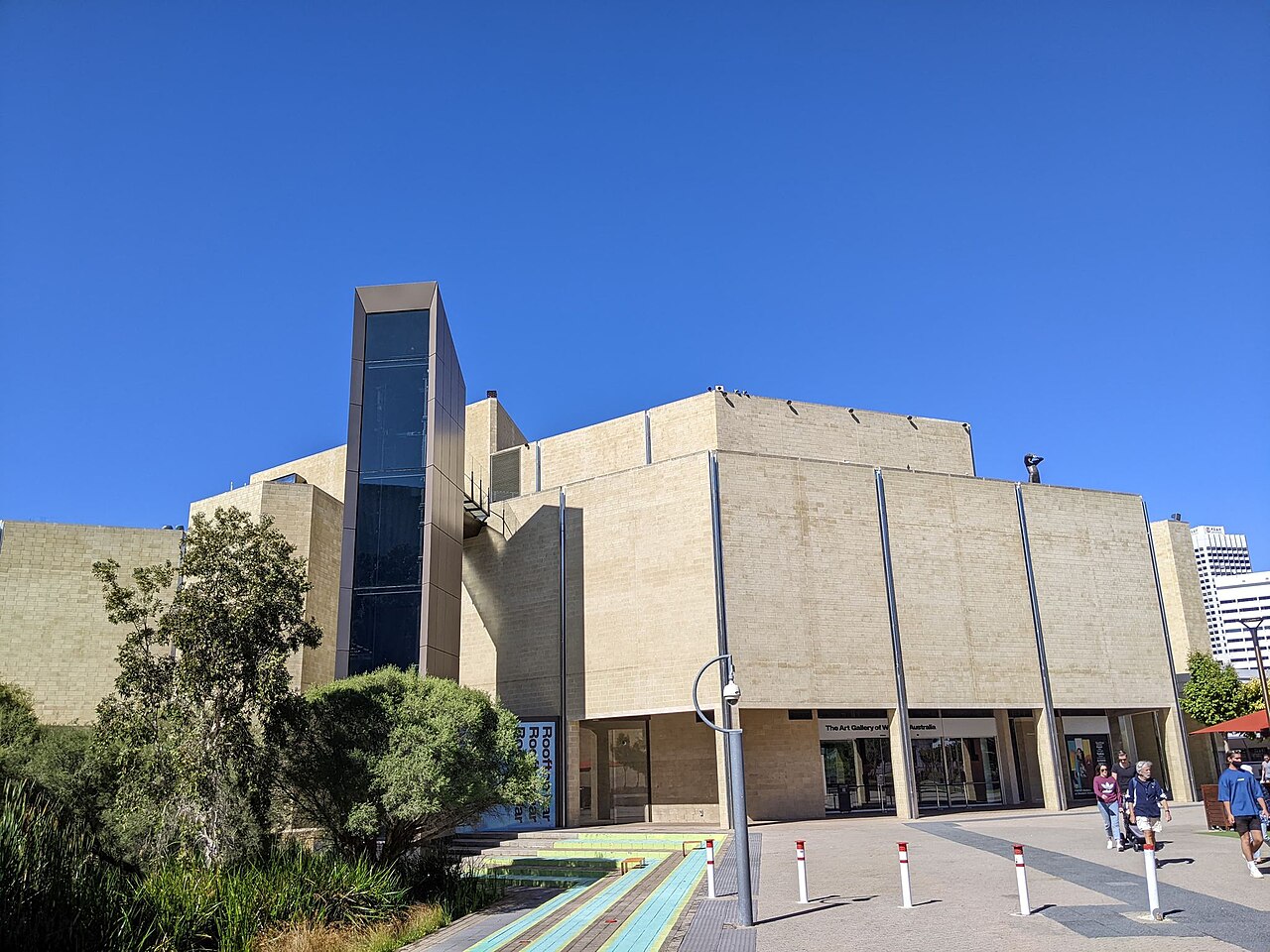 Main entrance and concrete facade of the Art Gallery of Western Australia, with the external lift tower.