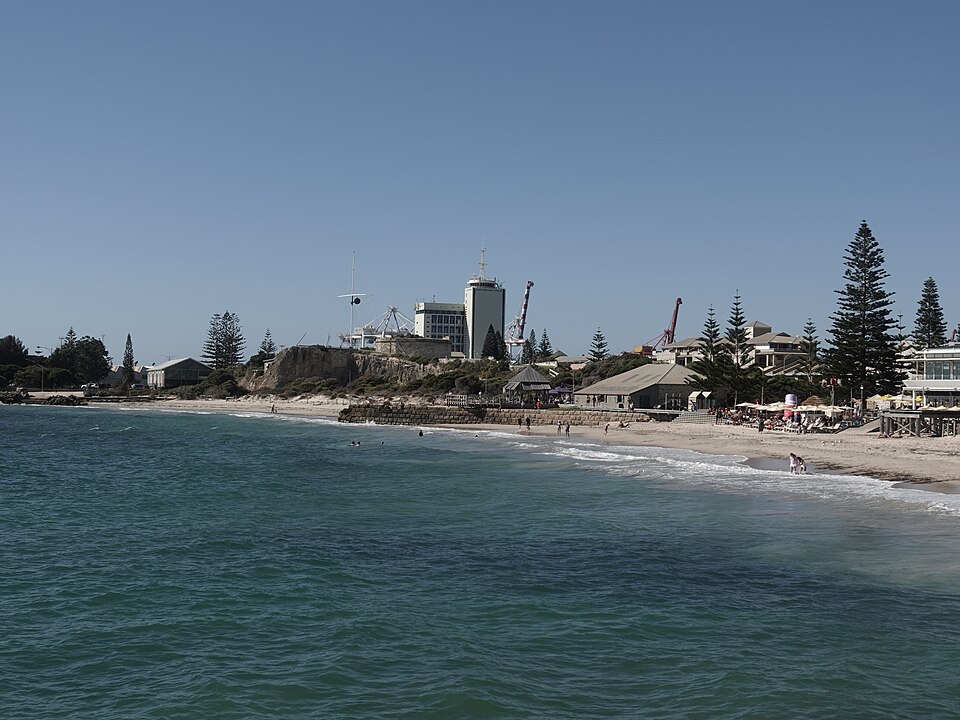 Bathers Beach with Arthur Head and waterfront buildings behind the sand.