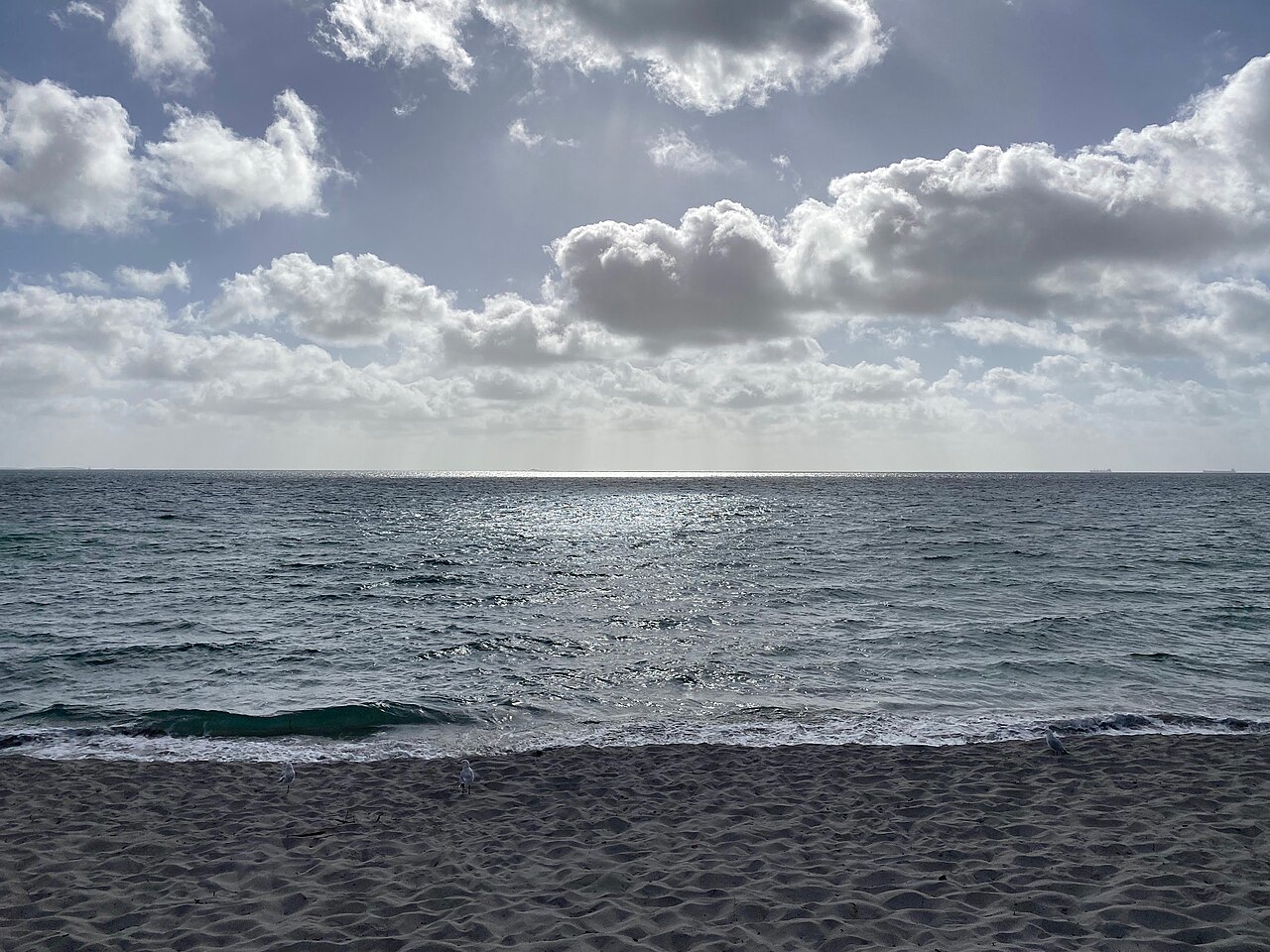 Sand and shallow waves at South Beach Fremantle.