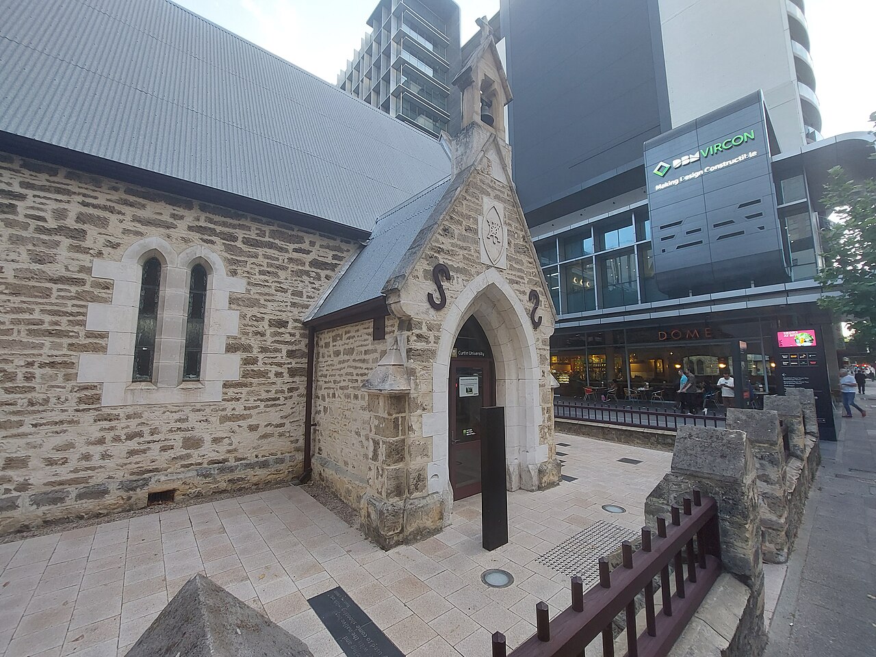 Stone walls and pointed entrance porch of Old Perth Boys’ School, seen from St Georges Terrace.