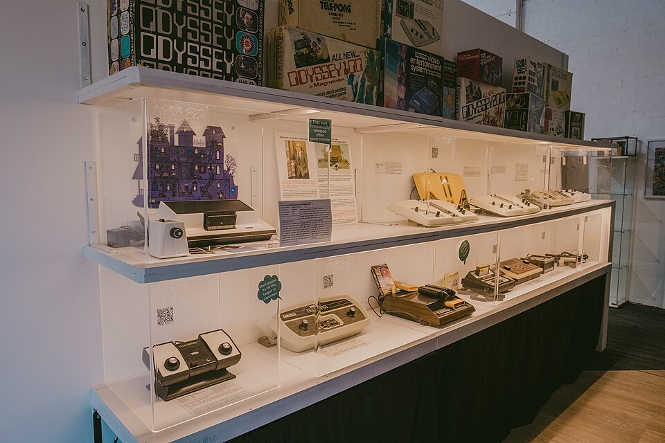 Rows of historic video game consoles on shelves at The Nostalgia Box.