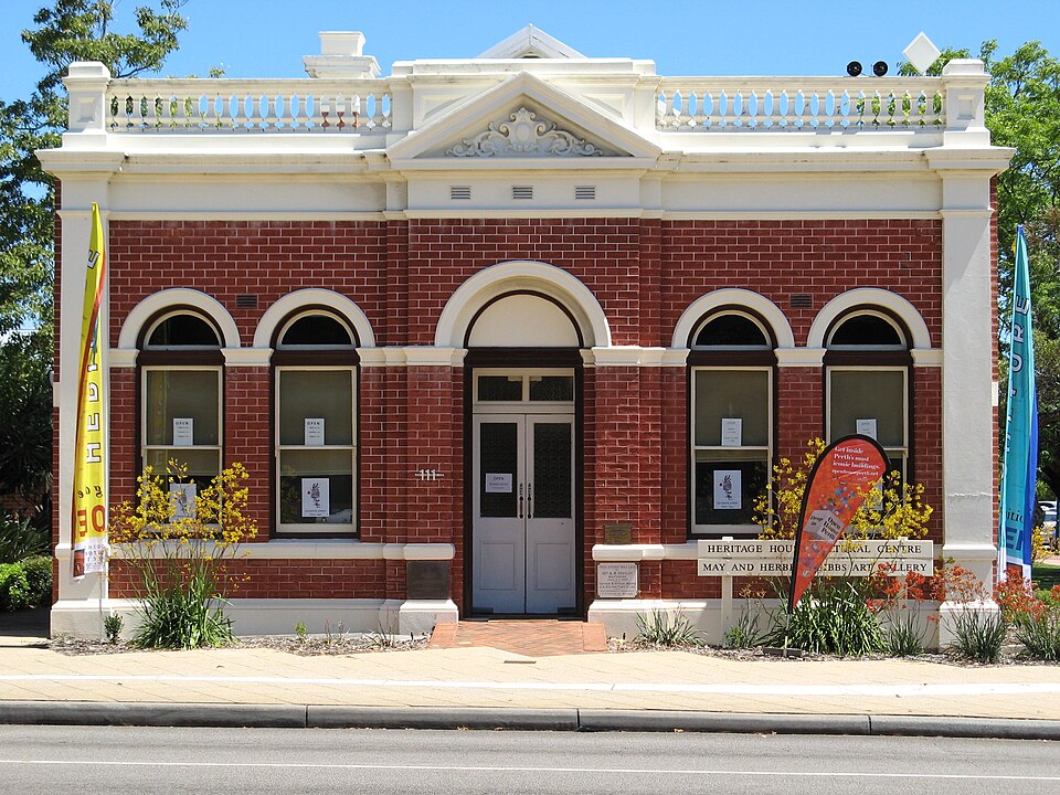 Red-brick South Perth Heritage House with pale classical details and central entrance.