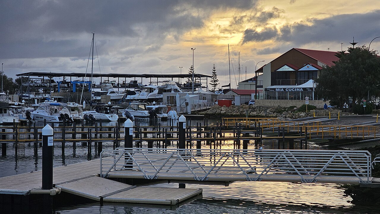 Boats, marina pontoons and waterfront buildings at Hillarys Boat Harbour.